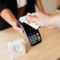 a person making a cashless shop transaction
